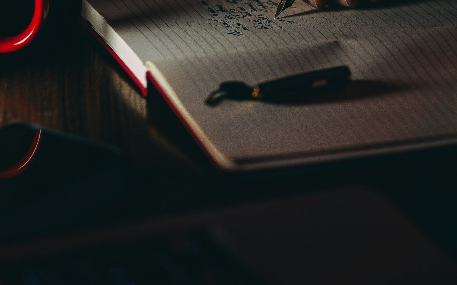A person filling in official paperwork by hand