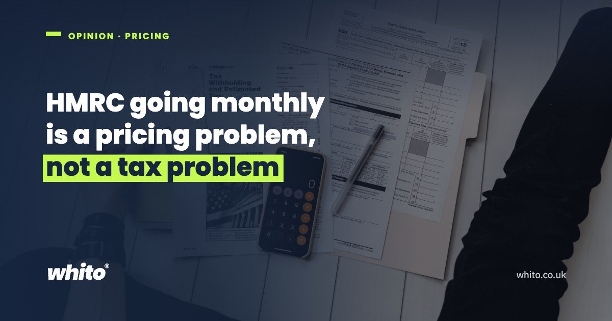 A person working through paperwork with a pen and calculator