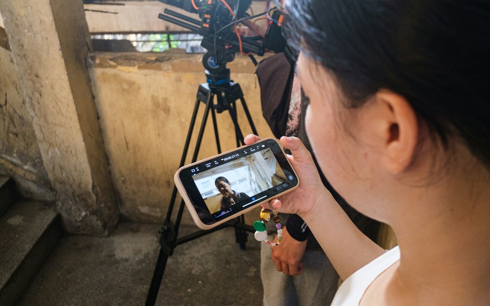 A woman watching a video on her phone