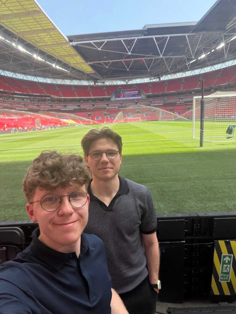Jacob (front) and Ethan Whitmore, the co-founders of Whito, at a football stadium